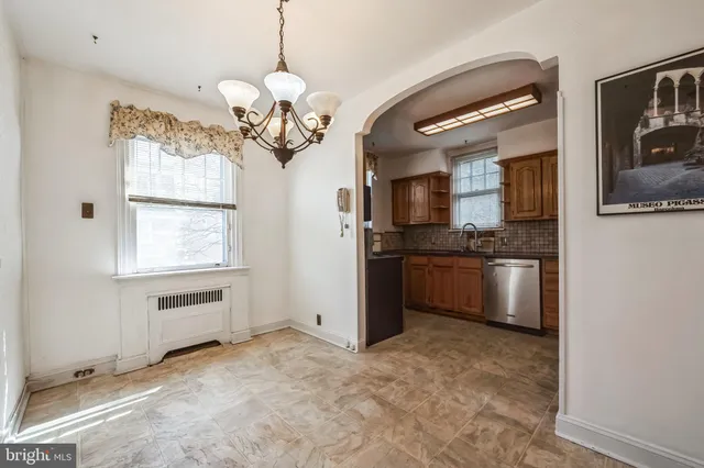 a kitchen with stainless steel appliances granite countertop a stove and a refrigerator