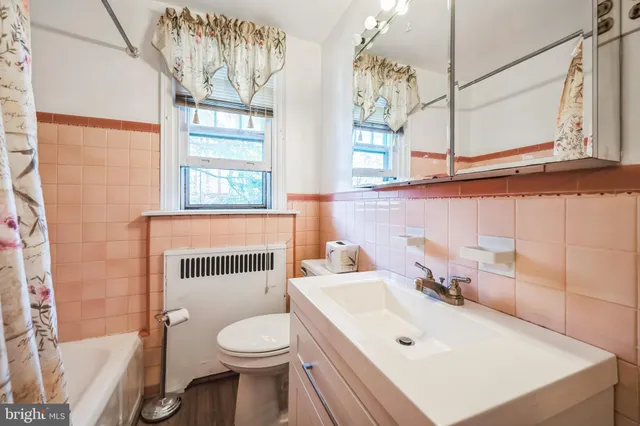 a bathroom with a sink a toilet and a bathtub