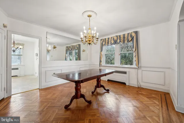 a room with pool table and windows