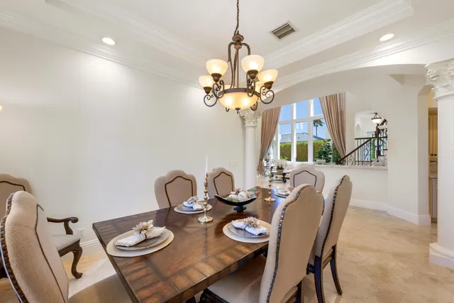 a living room with furniture and a view of kitchen