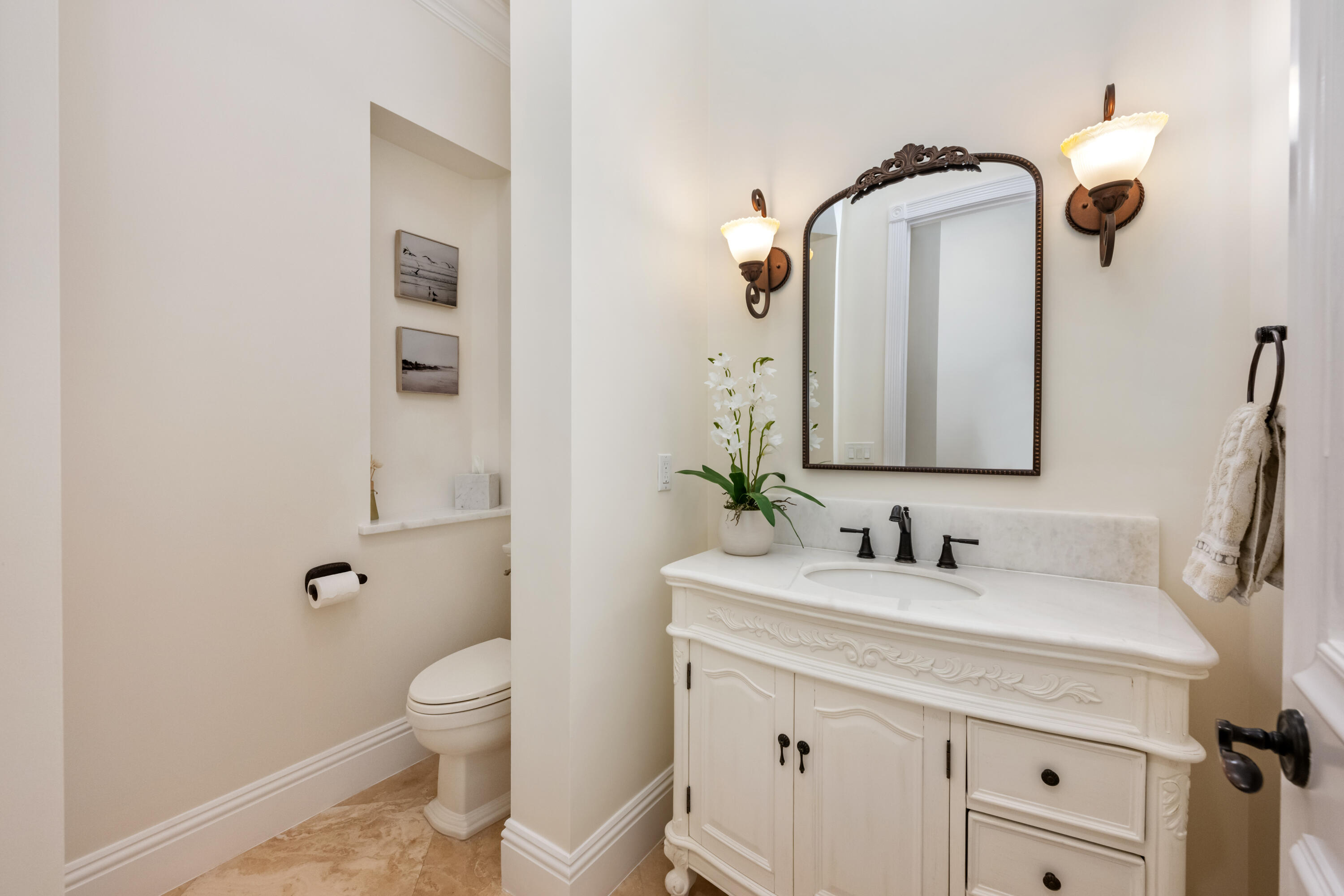 712 Northeast 71st Street Boca Raton, FL 33487 - Photo 16 of 97 a bathroom with a toilet sink and mirror