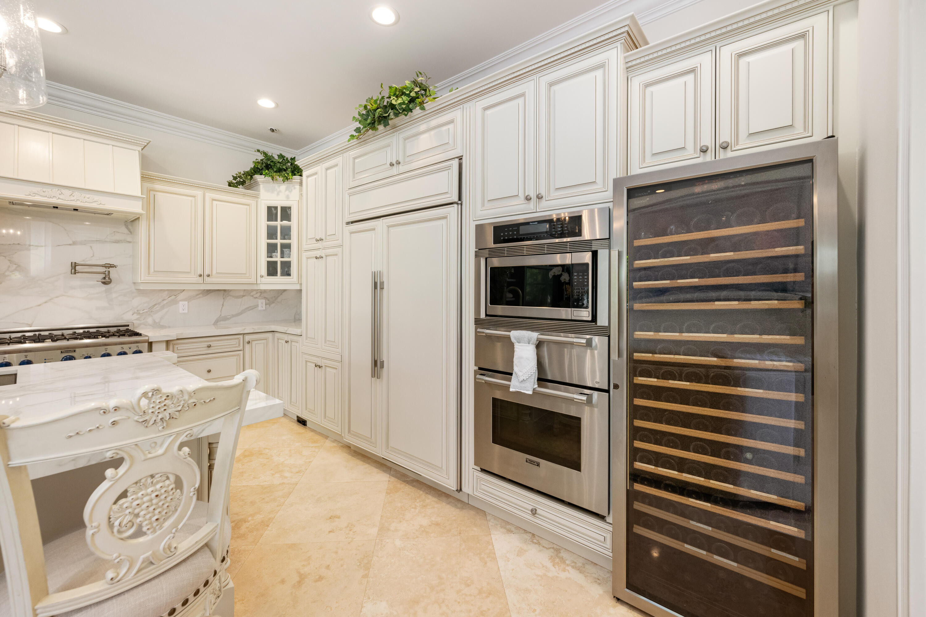 712 Northeast 71st Street Boca Raton, FL 33487 - Photo 20 of 97 a kitchen with stainless steel appliances white cabinets and a stove top oven