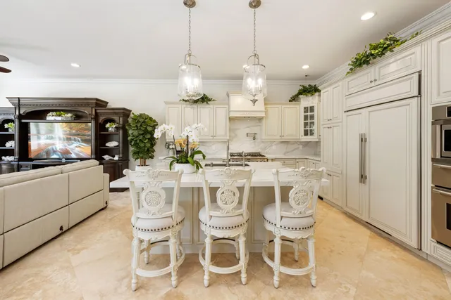 a view of a hallway with wooden floor and windows