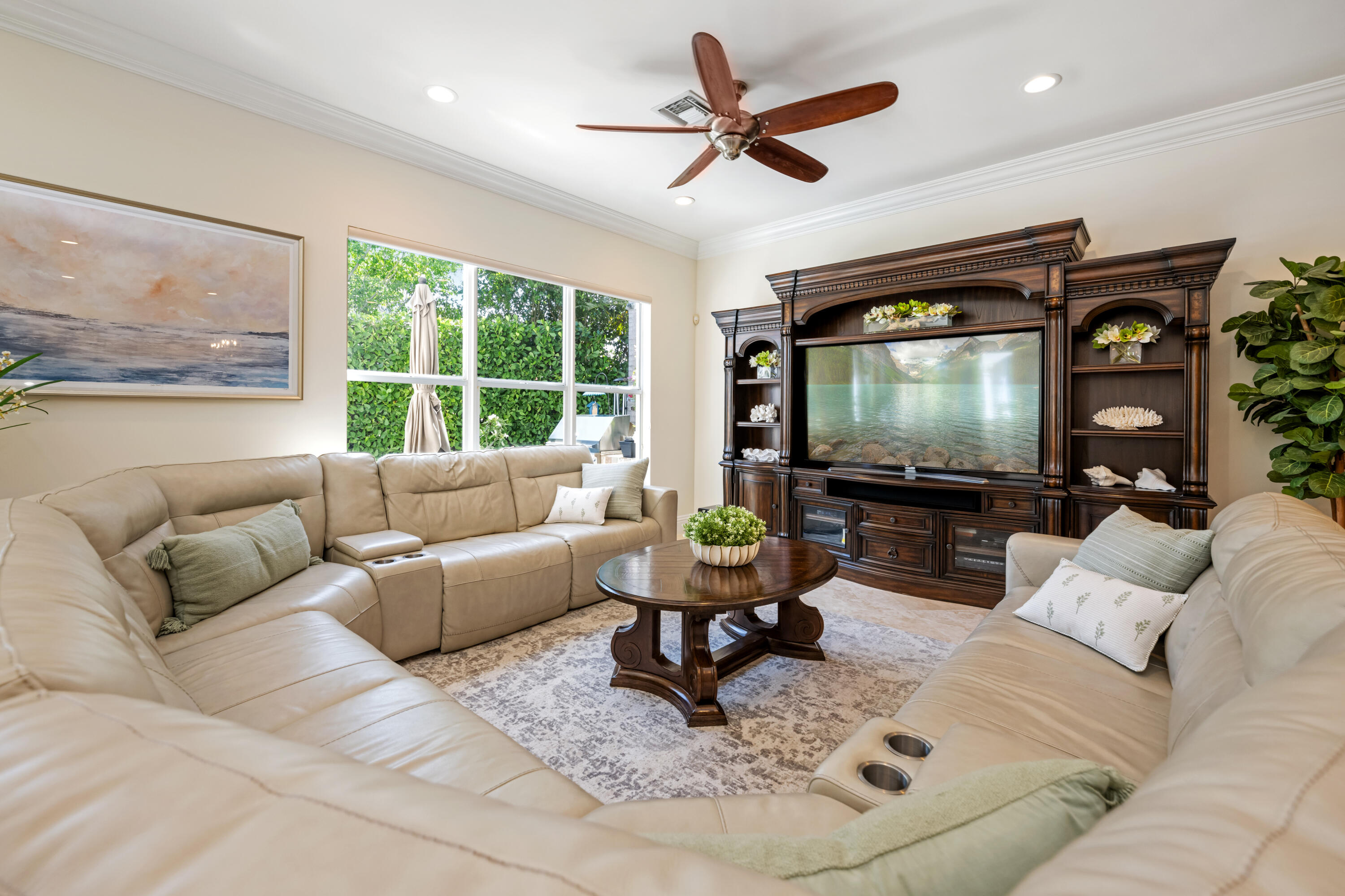 712 Northeast 71st Street Boca Raton, FL 33487 - Photo 26 of 97 a living room with furniture and a flat screen tv