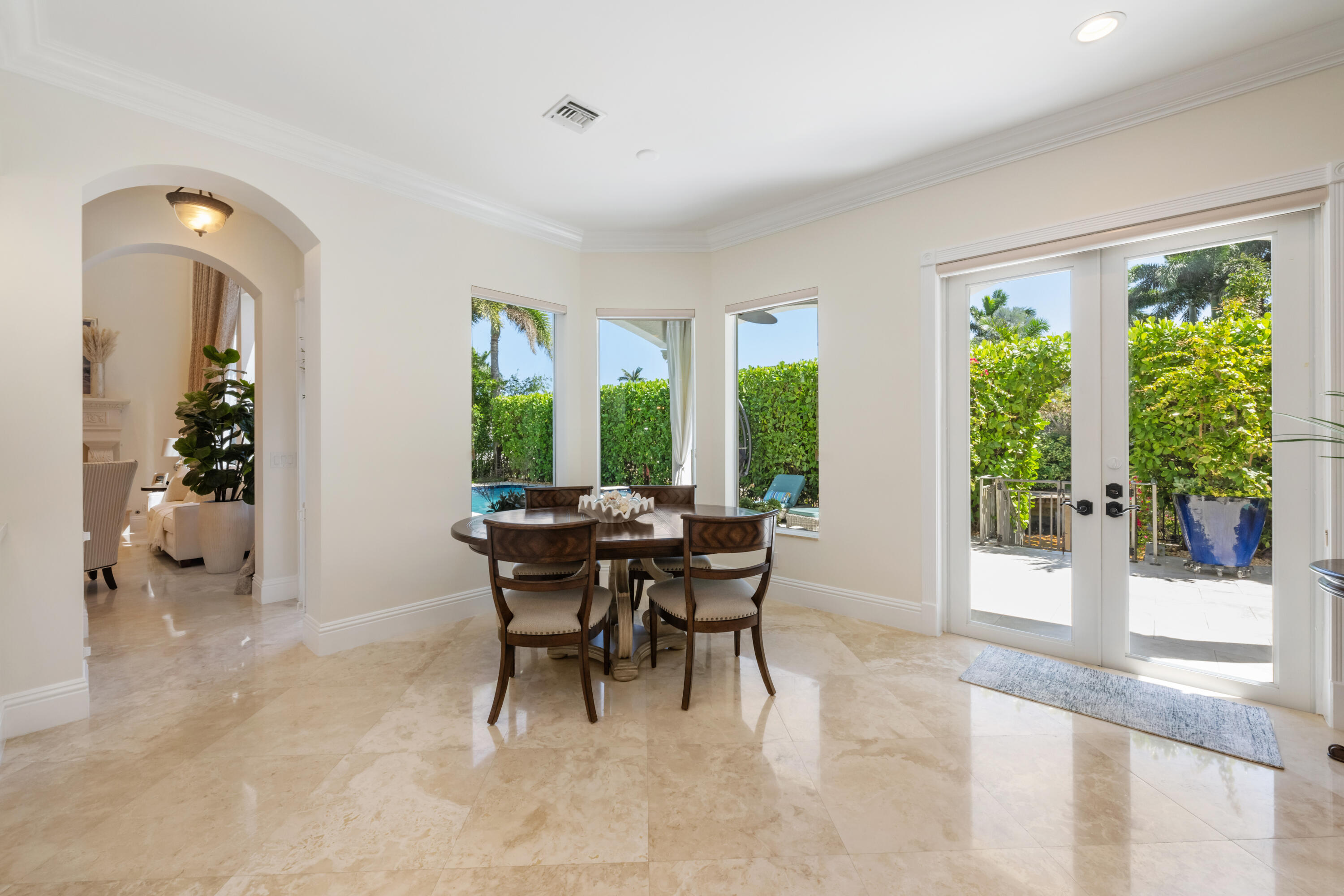 712 Northeast 71st Street Boca Raton, FL 33487 - Photo 30 of 97 a dining room with furniture and large windows