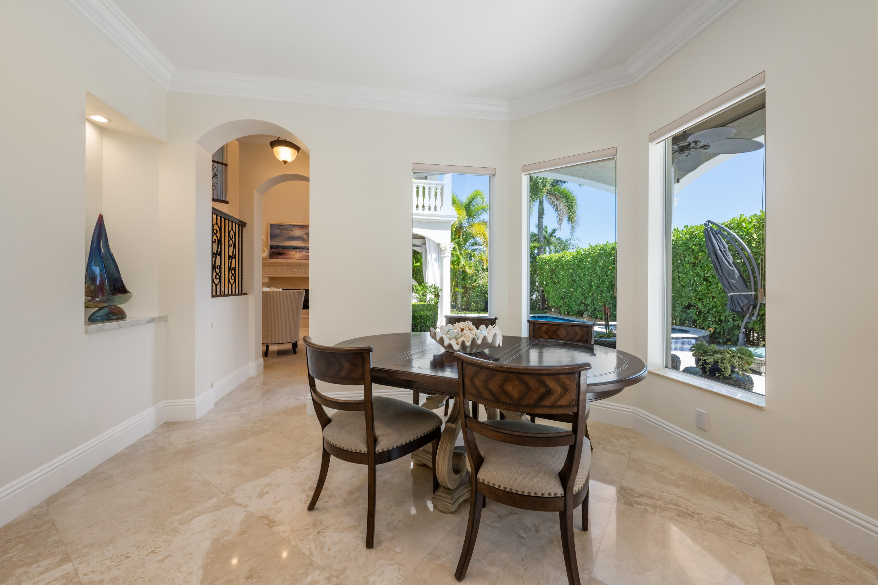 712 Northeast 71st Street Boca Raton, FL 33487 - Photo 31 of 97 a dining room with furniture and a large window