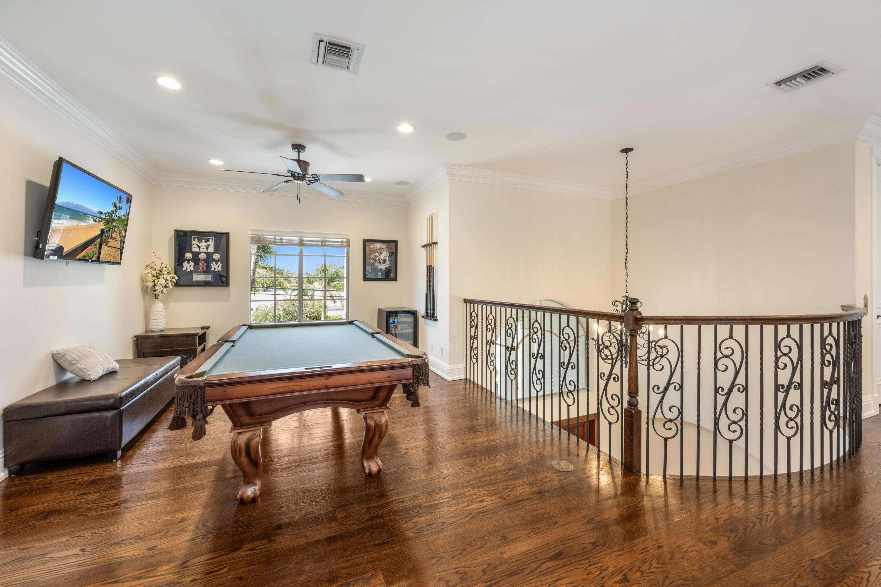 712 Northeast 71st Street Boca Raton, FL 33487 - Photo 33 of 97 a room with furniture pool table wooden floor and windows
