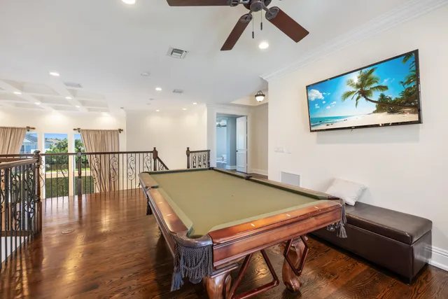 a bedroom with two beds and a potted plant
