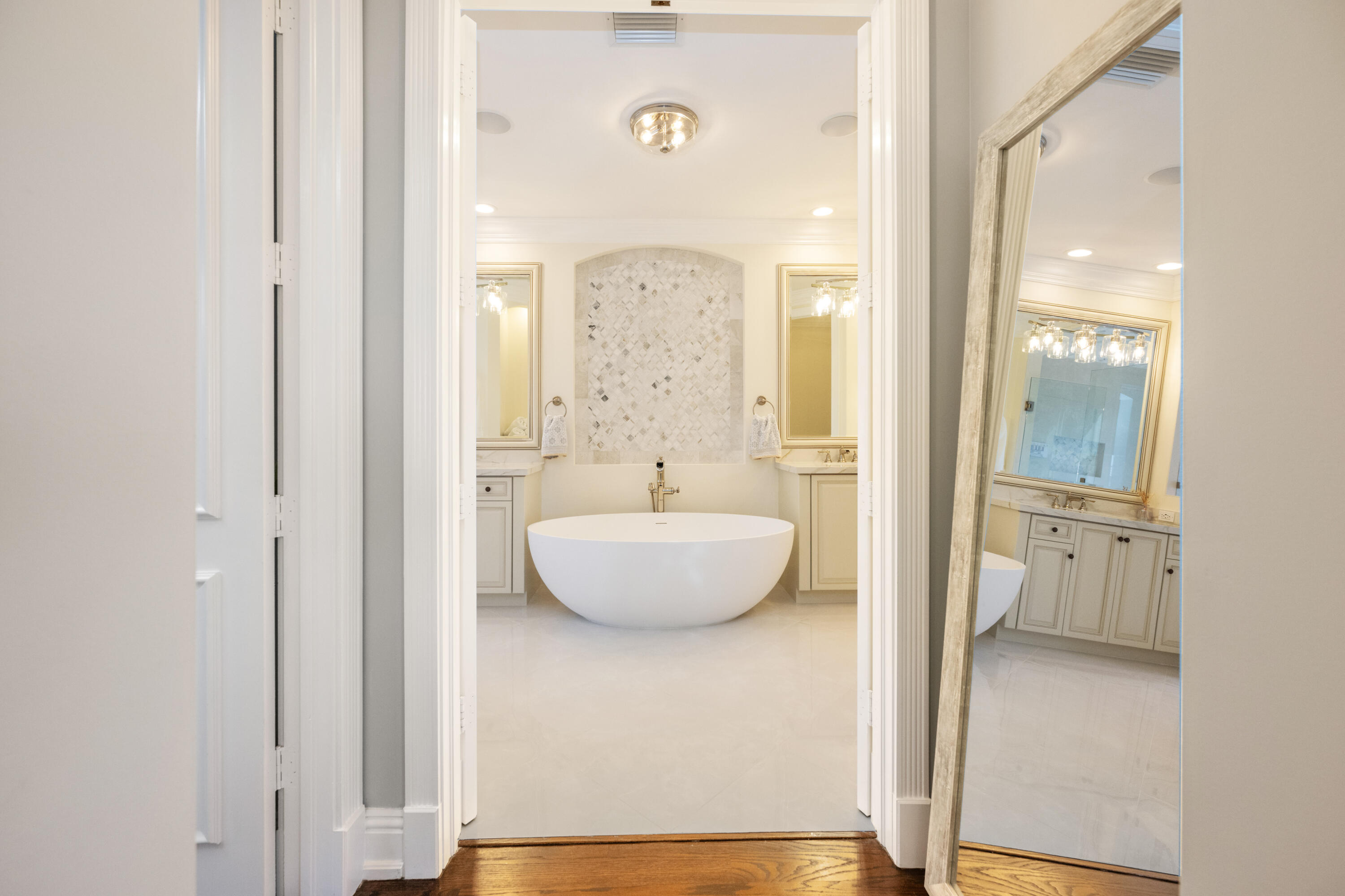 712 Northeast 71st Street Boca Raton, FL 33487 - Photo 41 of 97 a bathroom with a granite countertop sink a mirror and a shower