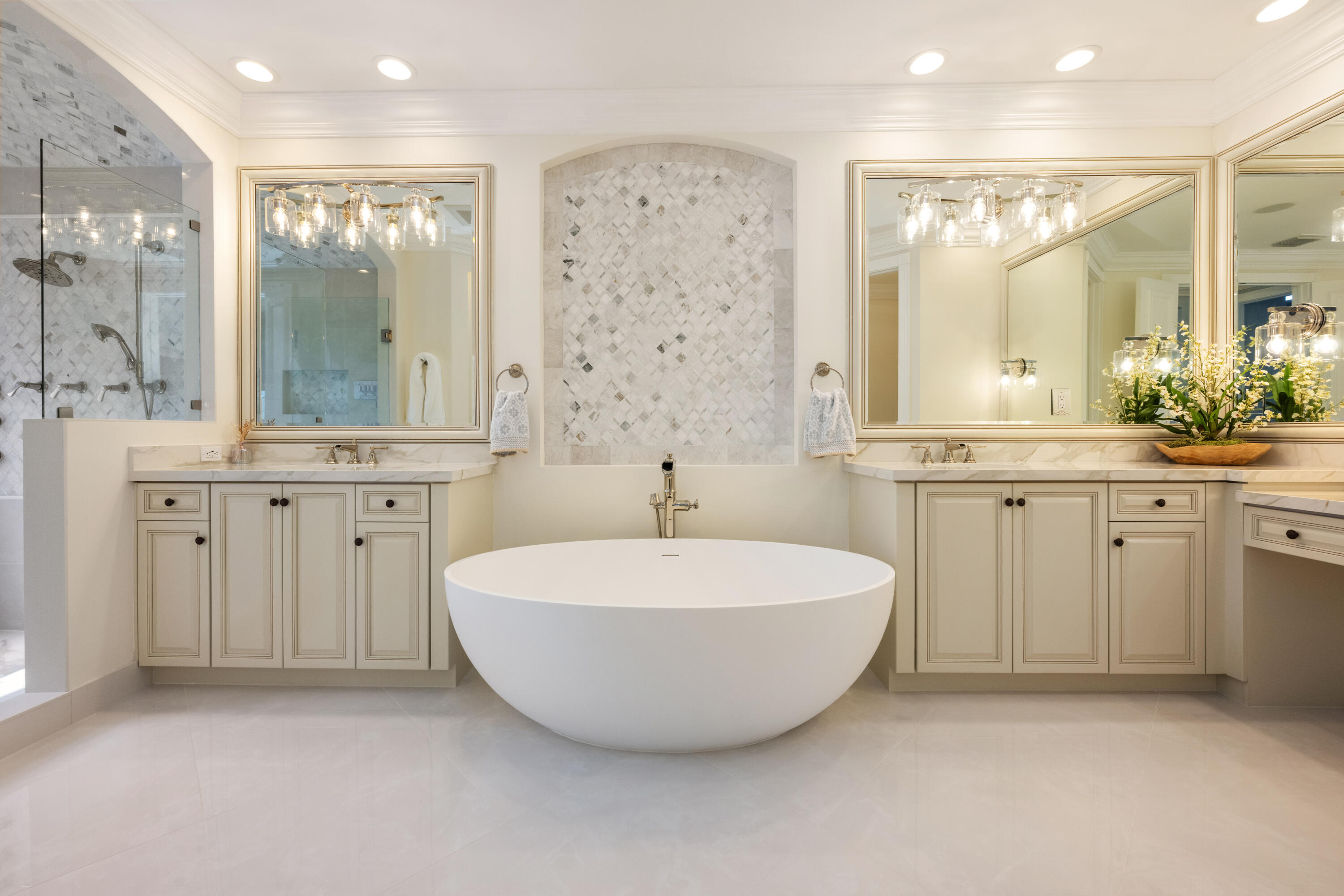 712 Northeast 71st Street Boca Raton, FL 33487 - Photo 42 of 97 a spacious bathroom with a double vanity sink mirror and a bathtub
