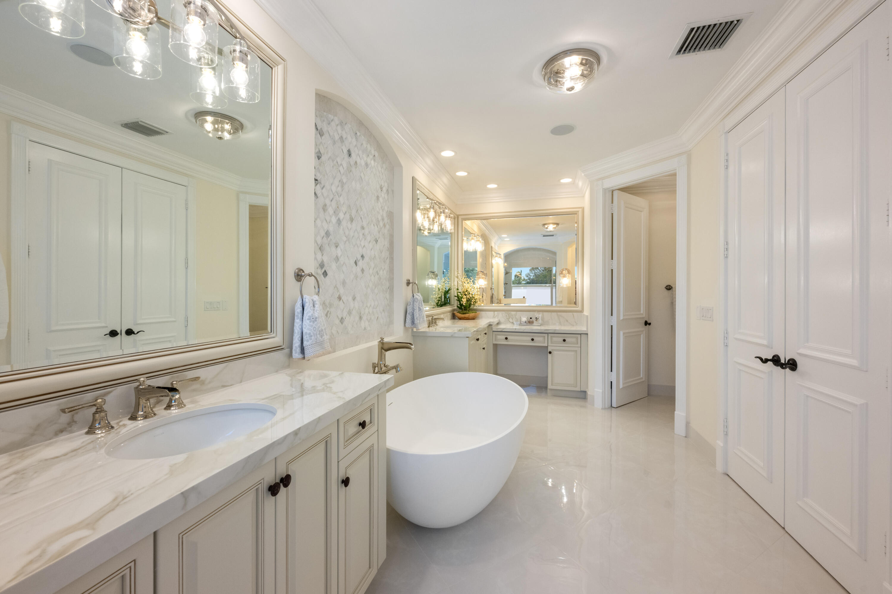 712 Northeast 71st Street Boca Raton, FL 33487 - Photo 46 of 97 a bathroom with a granite countertop sink a toilet a mirror and shower
