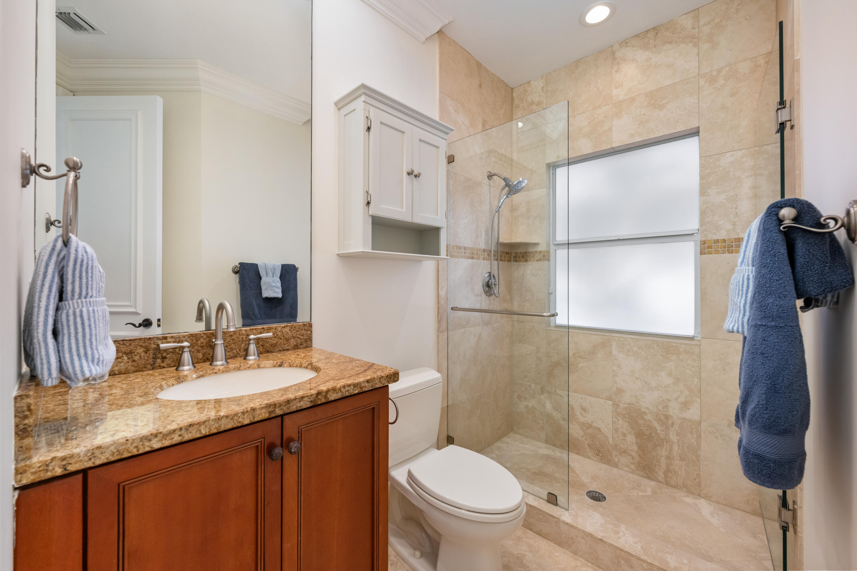 712 Northeast 71st Street Boca Raton, FL 33487 - Photo 55 of 97 a bathroom with a granite countertop sink toilet and shower