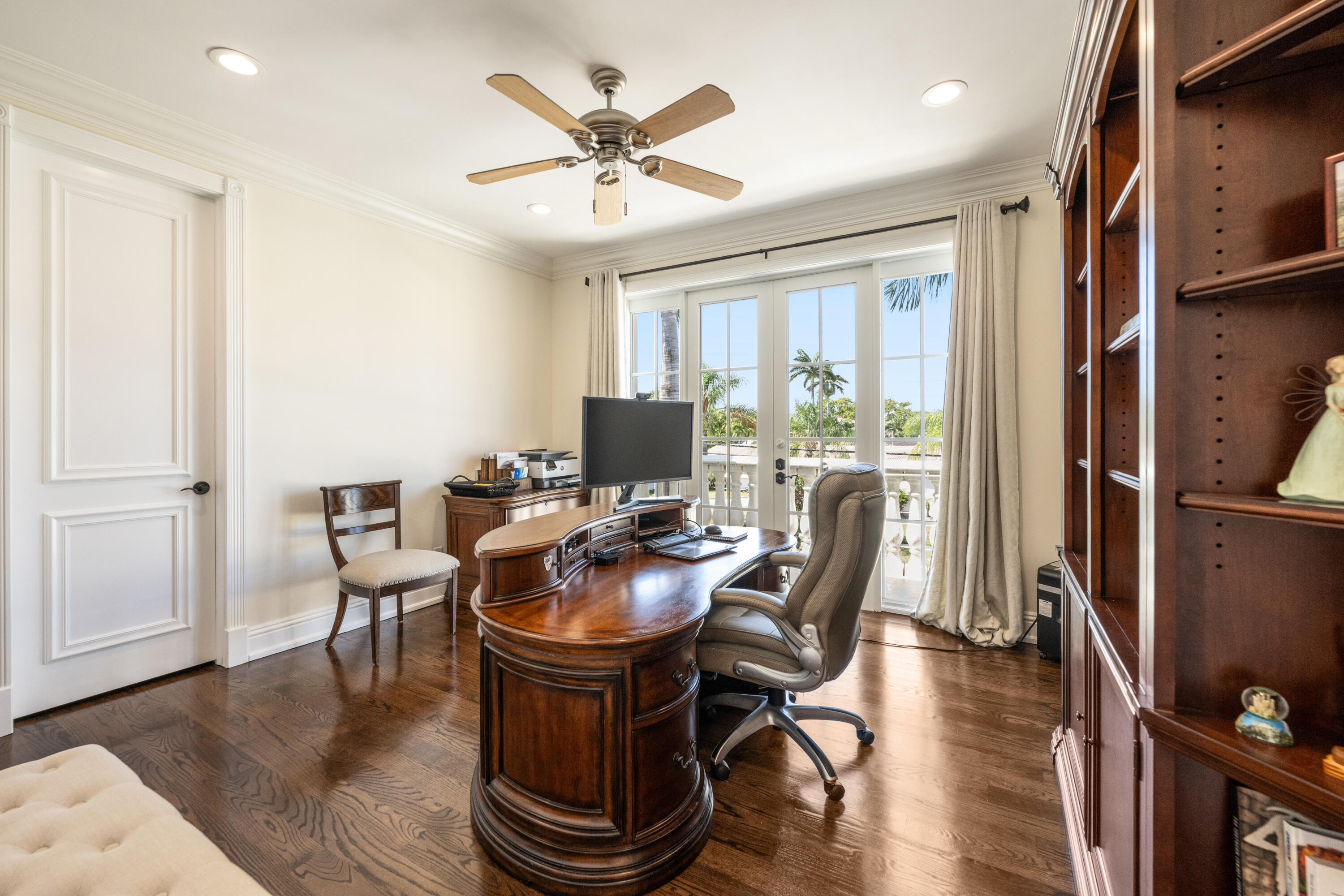 712 Northeast 71st Street Boca Raton, FL 33487 - Photo 60 of 97 a workspace with furniture window and wooden floor