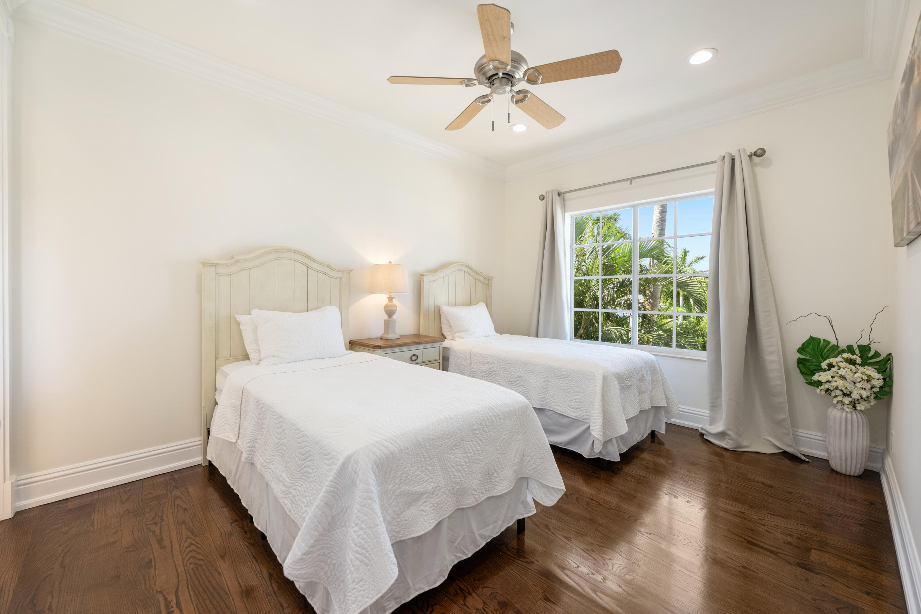 712 Northeast 71st Street Boca Raton, FL 33487 - Photo 65 of 97 a bedroom with two beds and a potted plant
