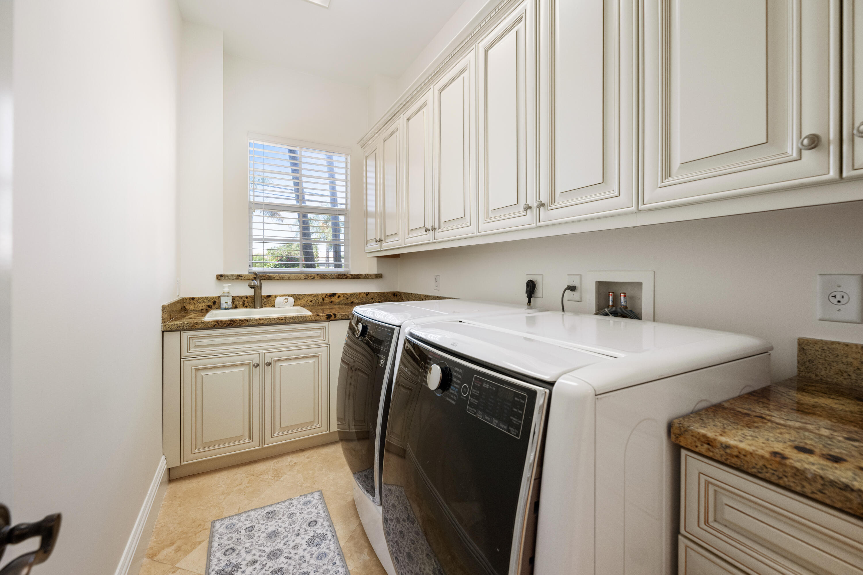 712 Northeast 71st Street Boca Raton, FL 33487 - Photo 67 of 97 a kitchen with stainless steel appliances granite countertop a sink stove and cabinets