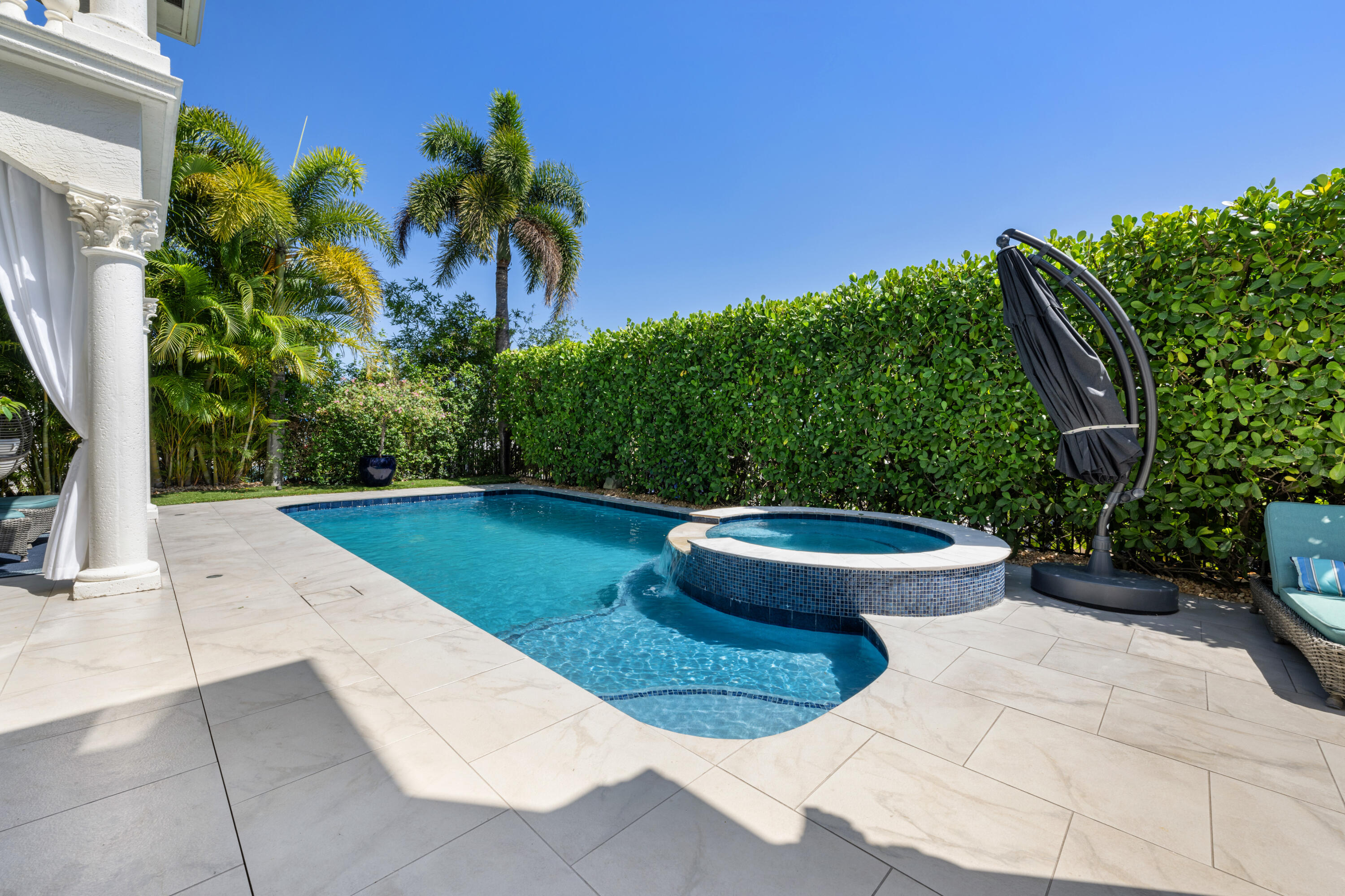 712 Northeast 71st Street Boca Raton, FL 33487 - Photo 75 of 97 a view of a swimming pool with an outdoor space