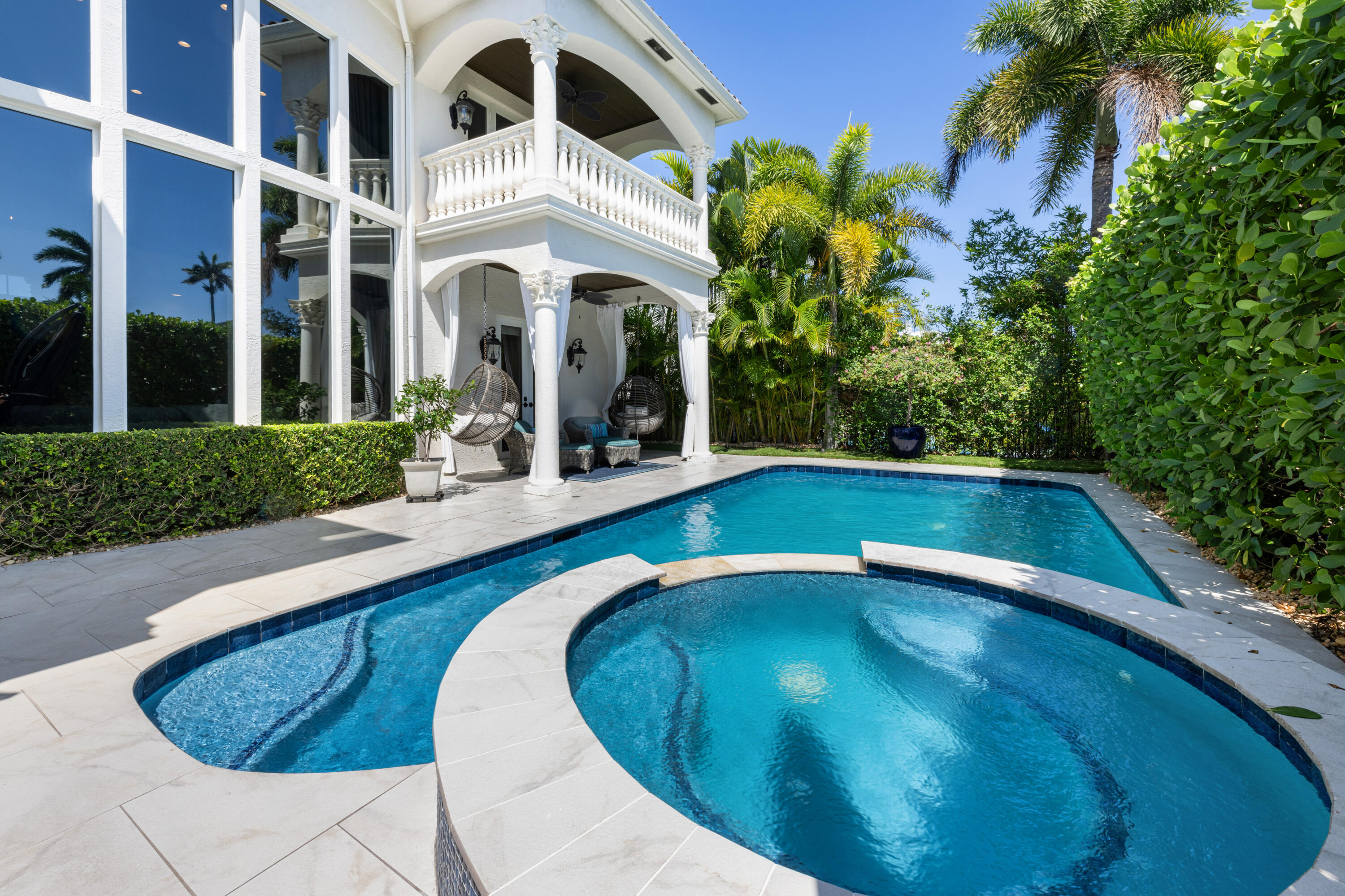 712 Northeast 71st Street Boca Raton, FL 33487 - Photo 76 of 97 a view of a swimming pool with a porch