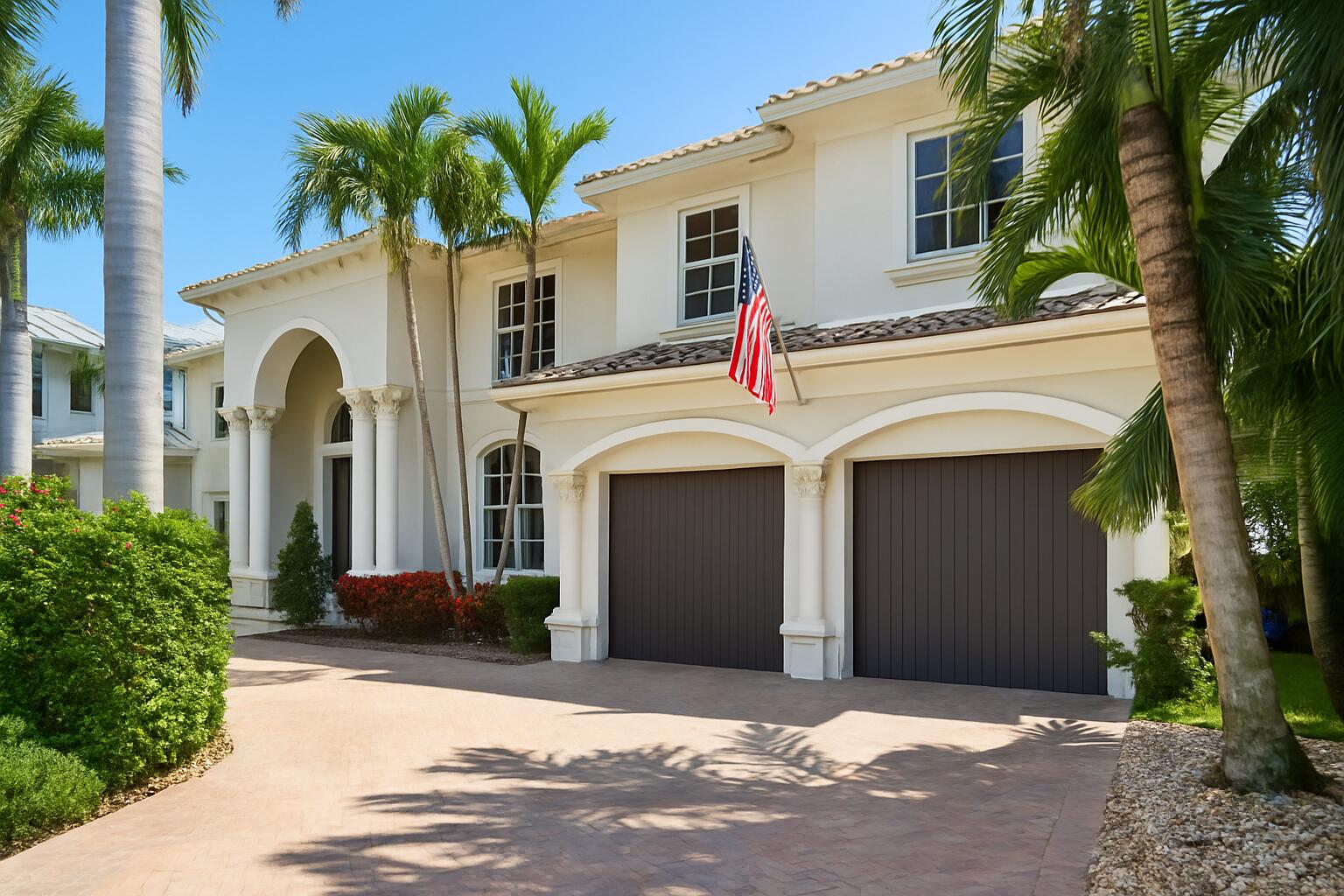 712 Northeast 71st Street Boca Raton, FL 33487 - Photo 91 of 97 a front view of a house with a garden