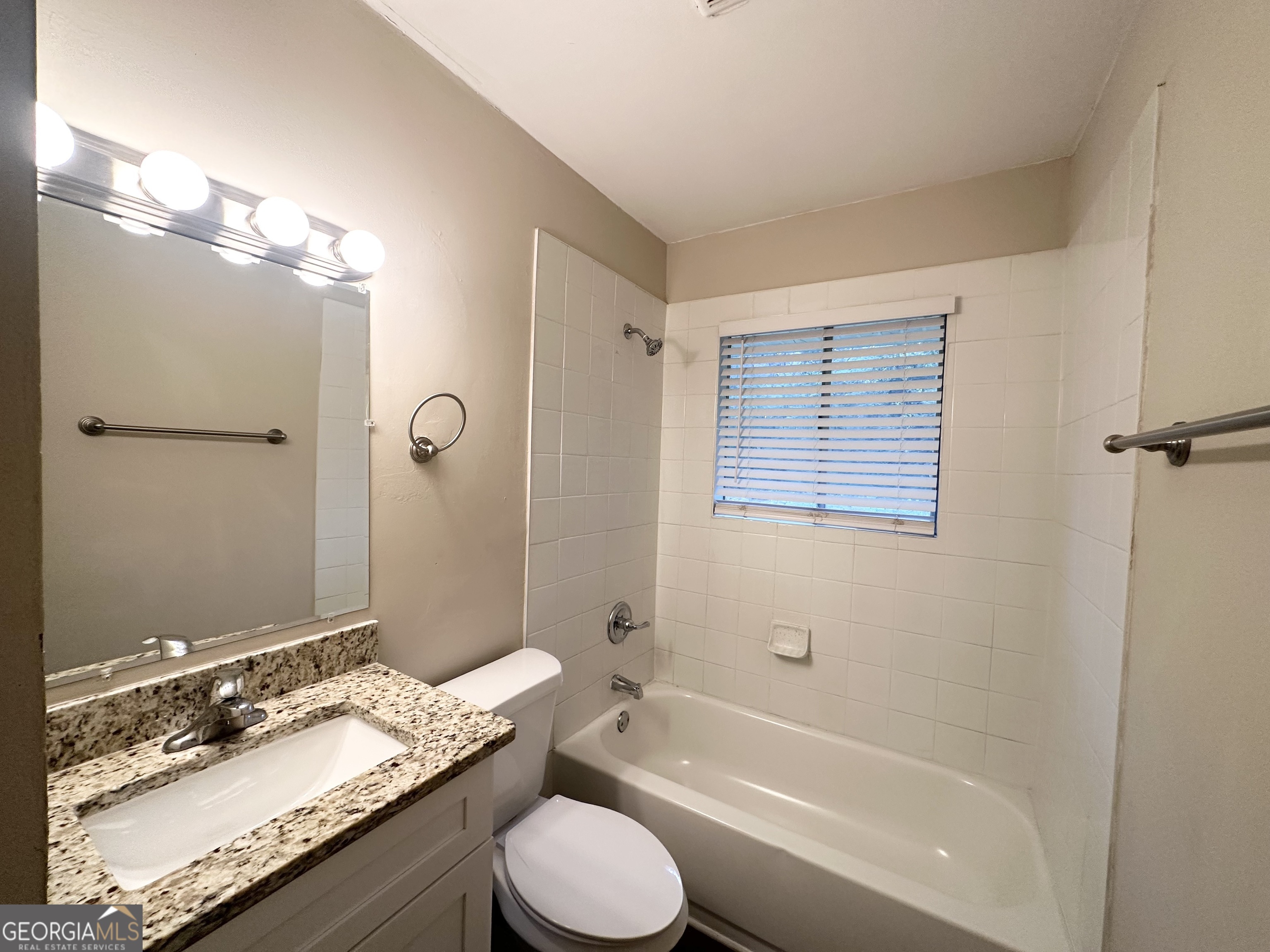 1519 Pine Glen Circle Decatur, GA 30035 - Photo 9 of 10 a bathroom with a granite countertop sink toilet mirror and bathtub