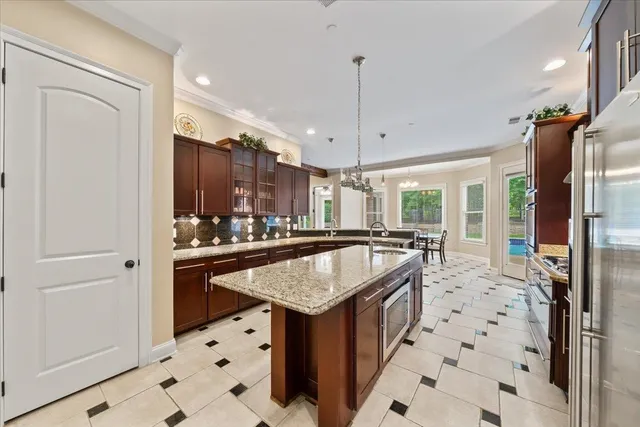 a dining room with a large window and table
