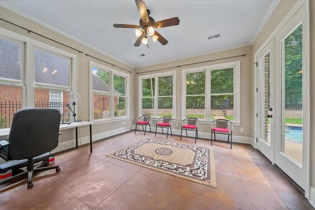 a bedroom with bed and ceiling fan