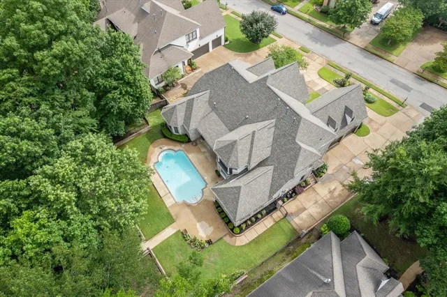 an aerial view of a house with a garden