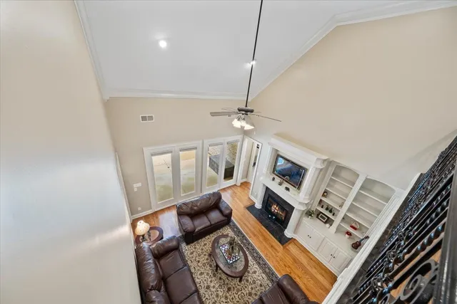 a bedroom with a large bed a chandelier and closet