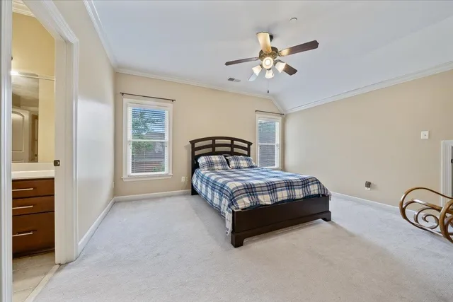 a spacious bathroom with a sink a large mirror and shower
