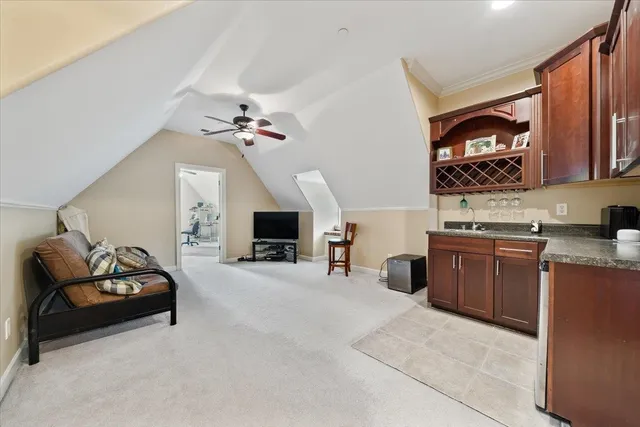 a living room with furniture and a rug