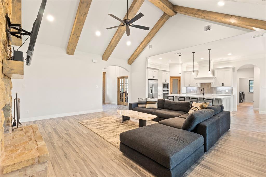 105 Clayton Crossing Springtown, TX 76082 - Photo 6 of 40 a living room with furniture and a wooden floor