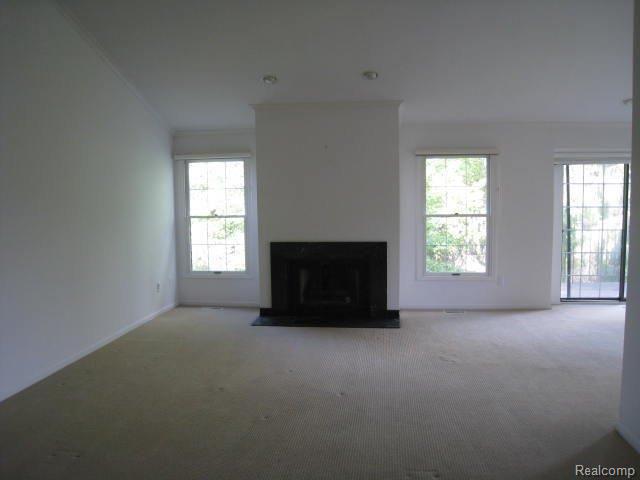 6450 Noble Road, Unit 4 West Bloomfield, MI 48322 - Photo 2 of 8 GREAT ROOM W/FIREPLACE