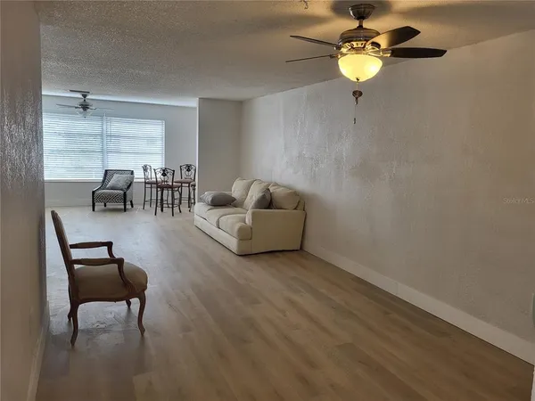 a living room with furniture and a window