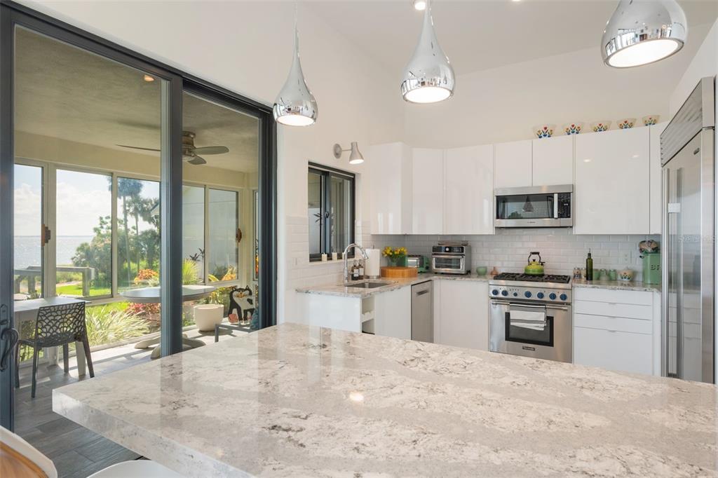 17640 Broad Street Montverde, FL 34756 - Photo 12 of 48 a kitchen with a stove a sink and a refrigerator