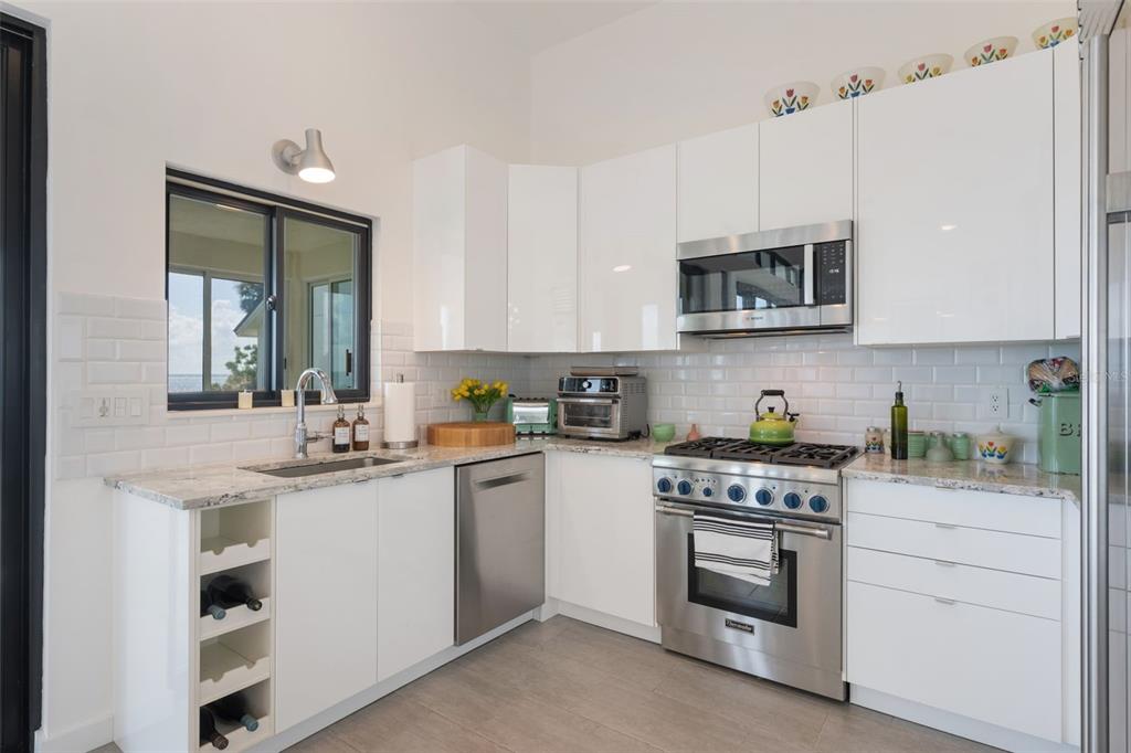 17640 Broad Street Montverde, FL 34756 - Photo 14 of 48 a kitchen with a sink stove and microwave