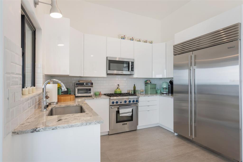 17640 Broad Street Montverde, FL 34756 - Photo 15 of 48 a kitchen with a refrigerator stove and sink