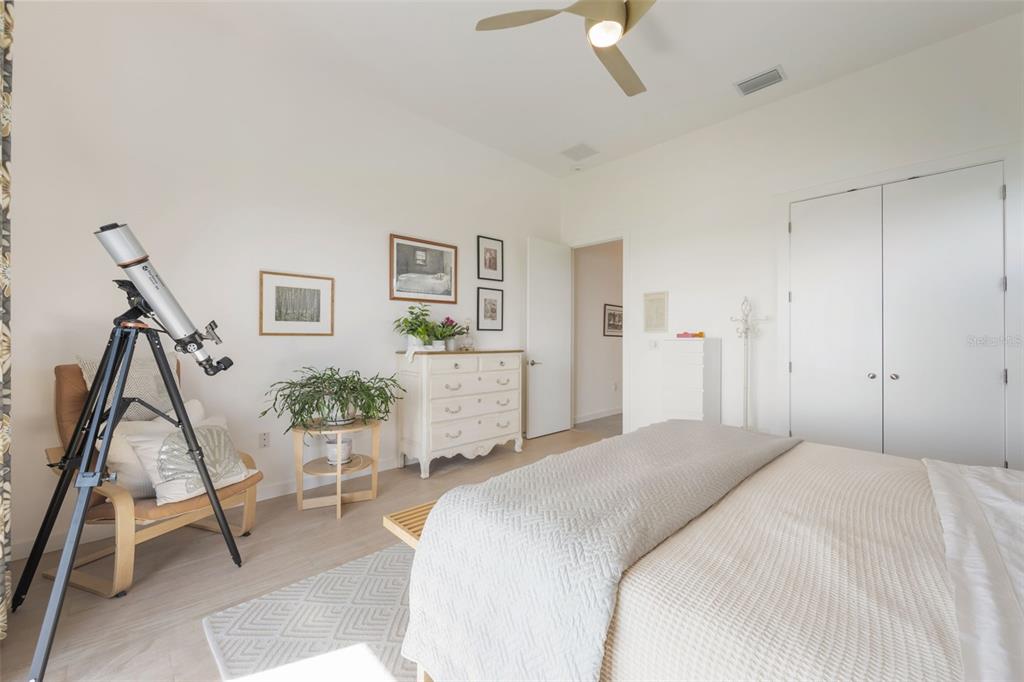 17640 Broad Street Montverde, FL 34756 - Photo 17 of 48 a bedroom with a bed and a chair