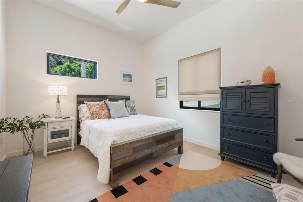 17640 Broad Street Montverde, FL 34756 - Photo 20 of 48 a bedroom with a bed and a couch