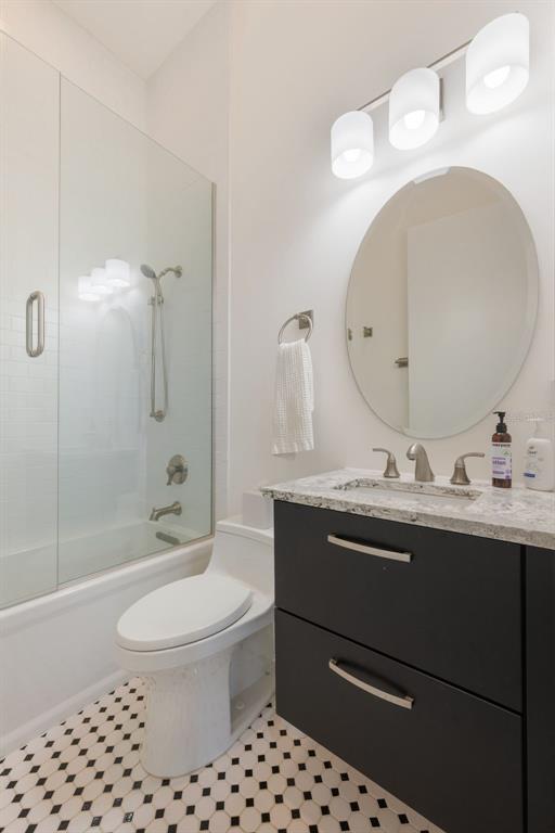 17640 Broad Street Montverde, FL 34756 - Photo 22 of 48 a bathroom with a sink a toilet and shower