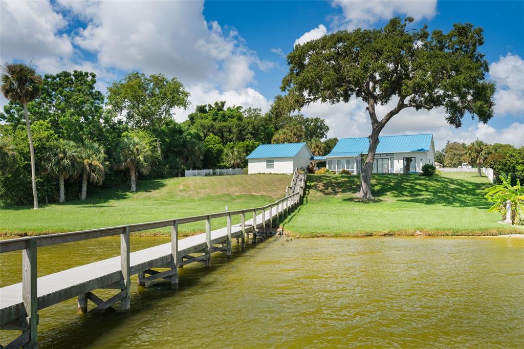 17640 Broad Street Montverde, FL 34756 - Photo 33 of 48 a view of a swimming pool with a garden