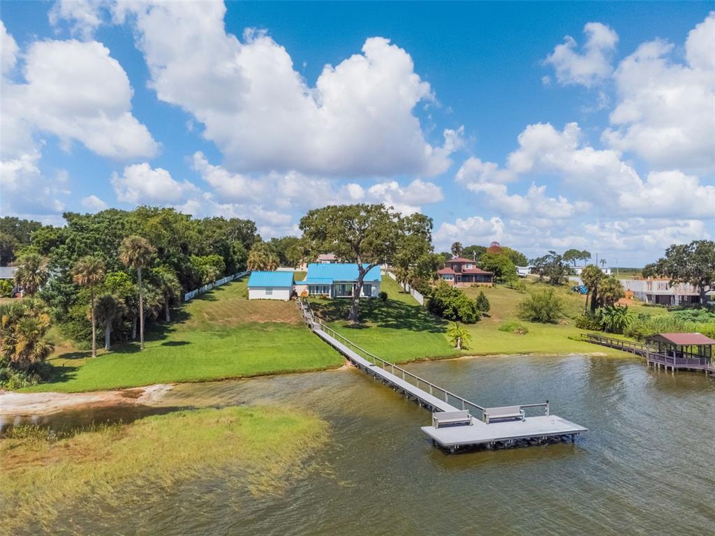 17640 Broad Street Montverde, FL 34756 - Photo 34 of 48 a view of a lake with a house in the background