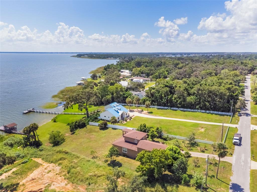 17640 Broad Street Montverde, FL 34756 - Photo 37 of 48 a view of a swimming pool with a yard