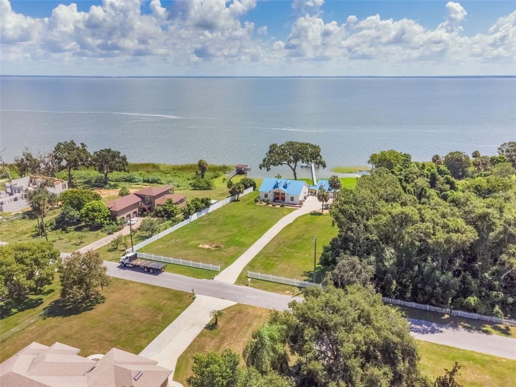 17640 Broad Street Montverde, FL 34756 - Photo 38 of 48 a view of a swimming pool with an outdoor space and seating area