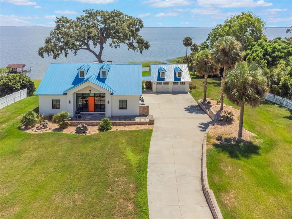 17640 Broad Street Montverde, FL 34756 - Photo 41 of 48 a swimming pool view with a outdoor seating