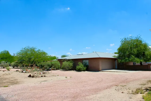 a view of a swimming pool with a yard