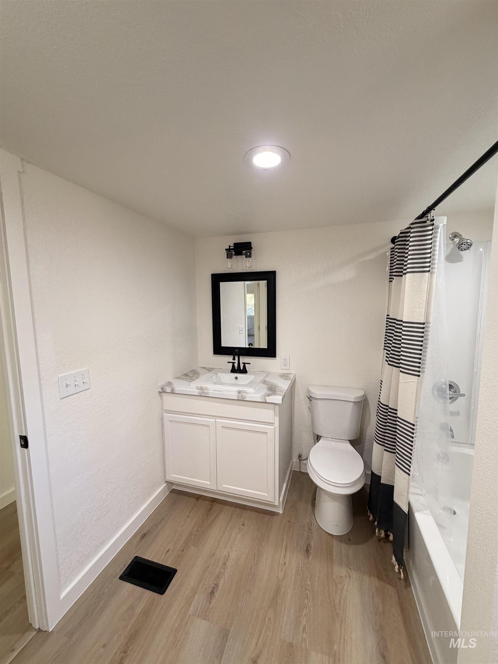 151 View Road Kamiah, ID 83536 - Photo 27 of 49 Bathroom with a single vanity featuring a white cabinet base and a marble-finish countertop