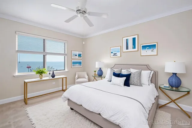 a bedroom with a bed a chandelier and dresser