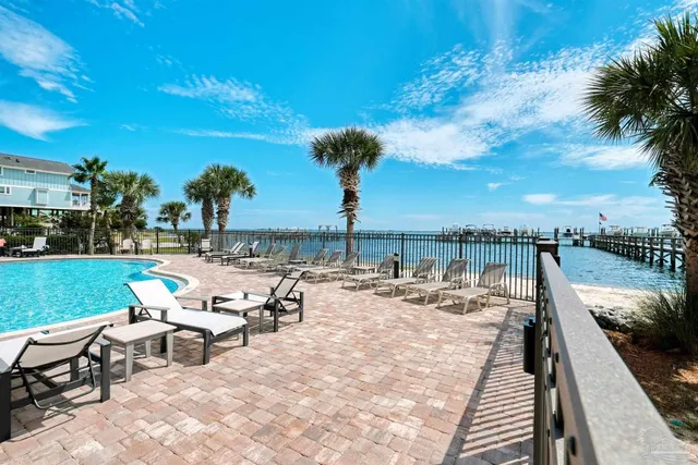 a bathroom with a sink a toilet a mirror and shower