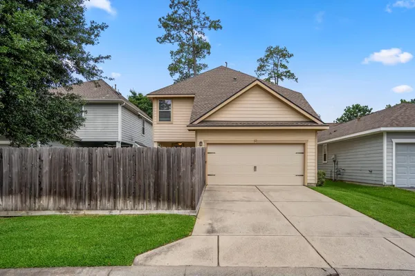 a front view of a house with yard