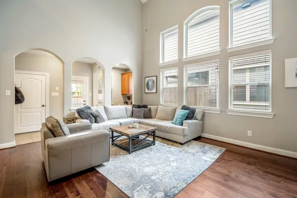 a living room with furniture and windows