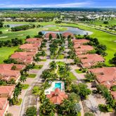 an aerial view of residential houses with outdoor space and river
